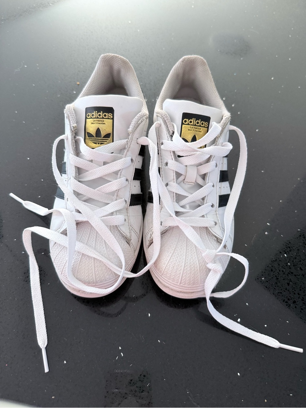 adidas White & Black Superstar Sneakers with Gold Tongue Logo